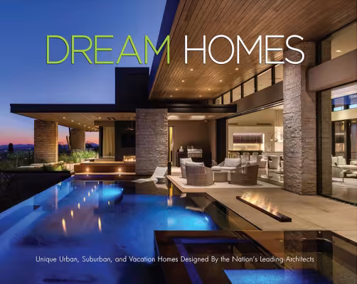 Modern house with large patio and pool at sunset.