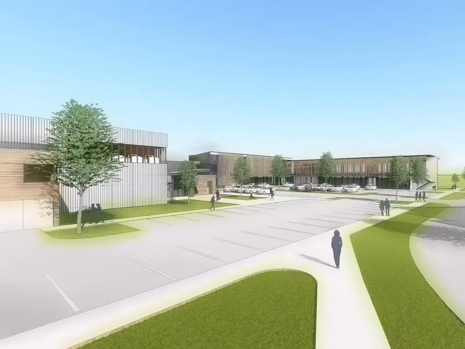 Modern building complex, clear sky, trees lining paths.