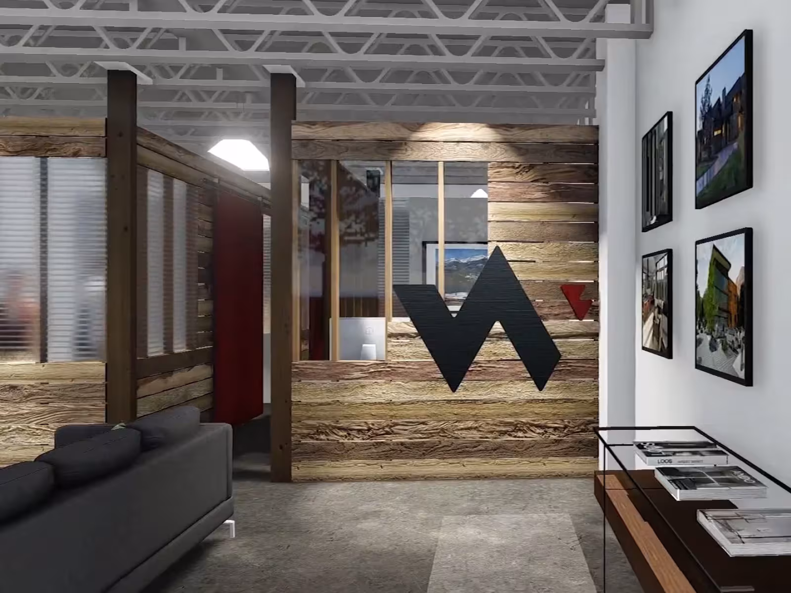 Office lobby with wooden walls, logo, and framed photos on white wall.