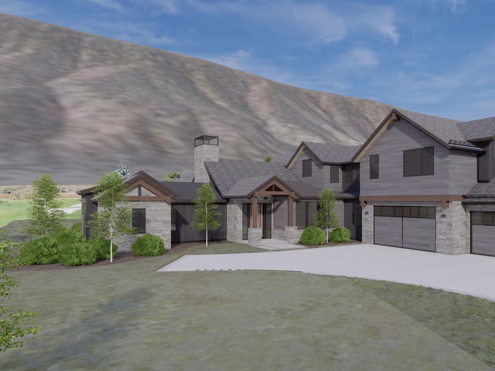 Large stone house with dark roof, mountain backdrop, and a clear blue sky.