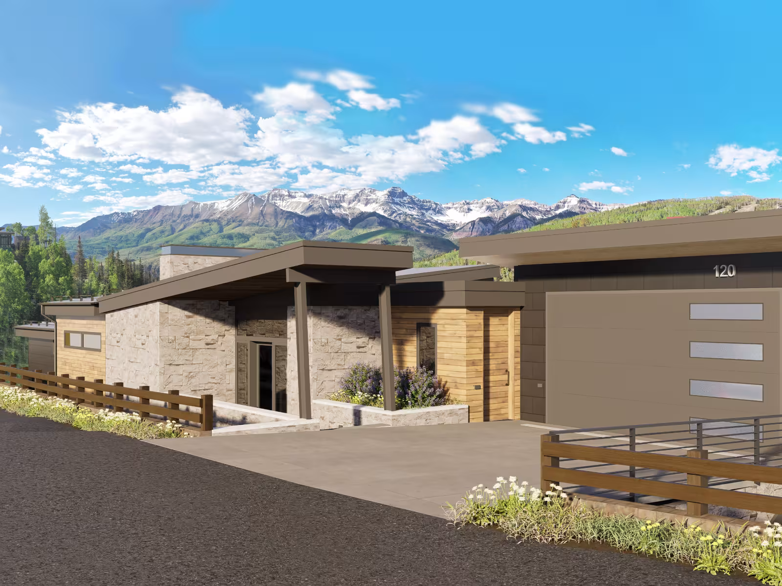 Modern house with flat roofs, mountain backdrop, clear sky.