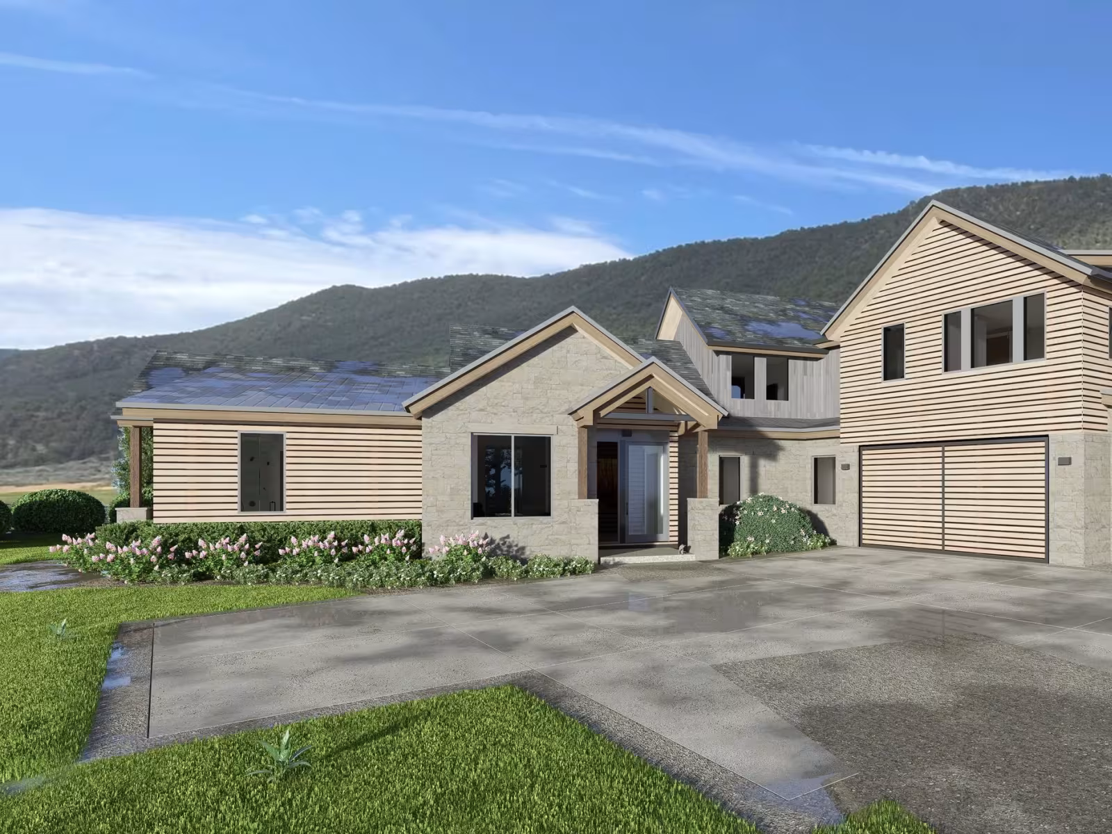 Modern house with a spacious driveway, set against a mountain backdrop.