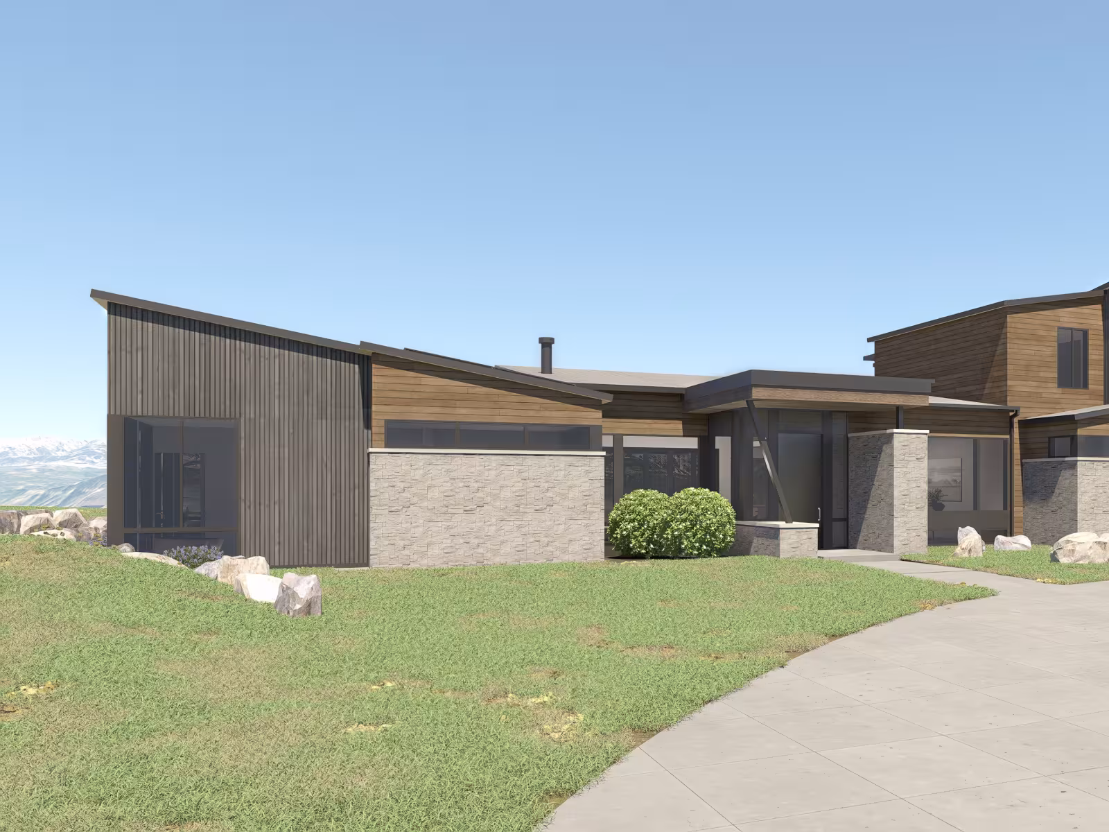 Modern house with wood and concrete exterior, set on grassy landscape under clear sky.